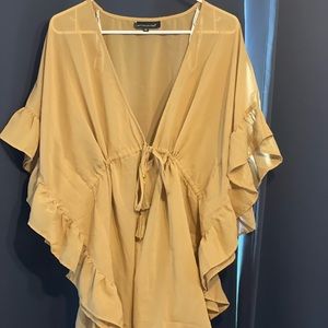 Sheer top with ruffled edges